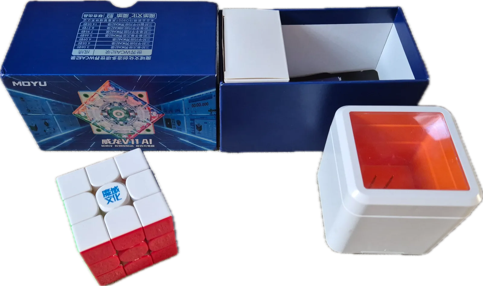 MoYu WeiLong V11 AI unboxing with the opened retail box, the cube and the charging box